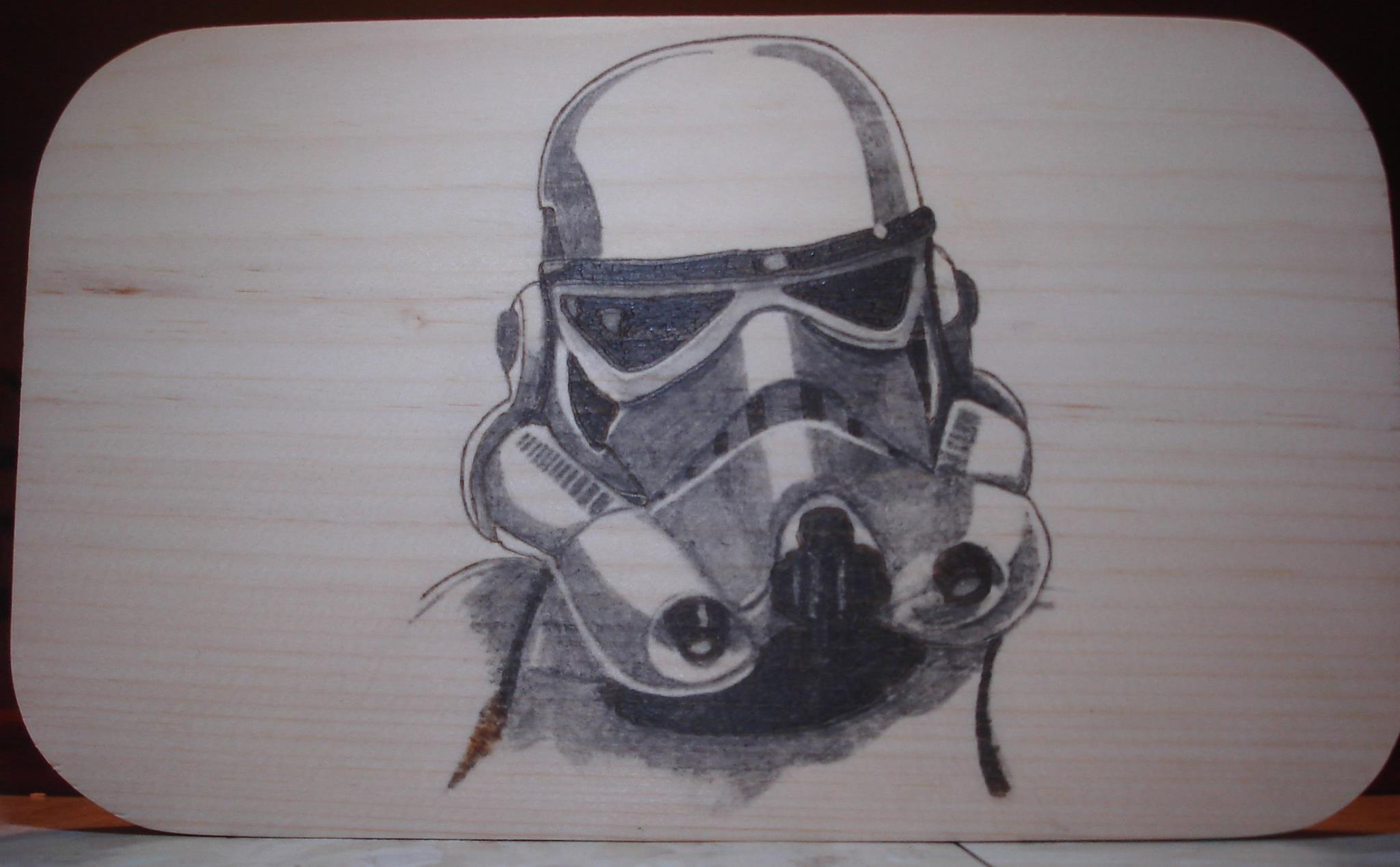Hand burned detailed character portrait on a wood board