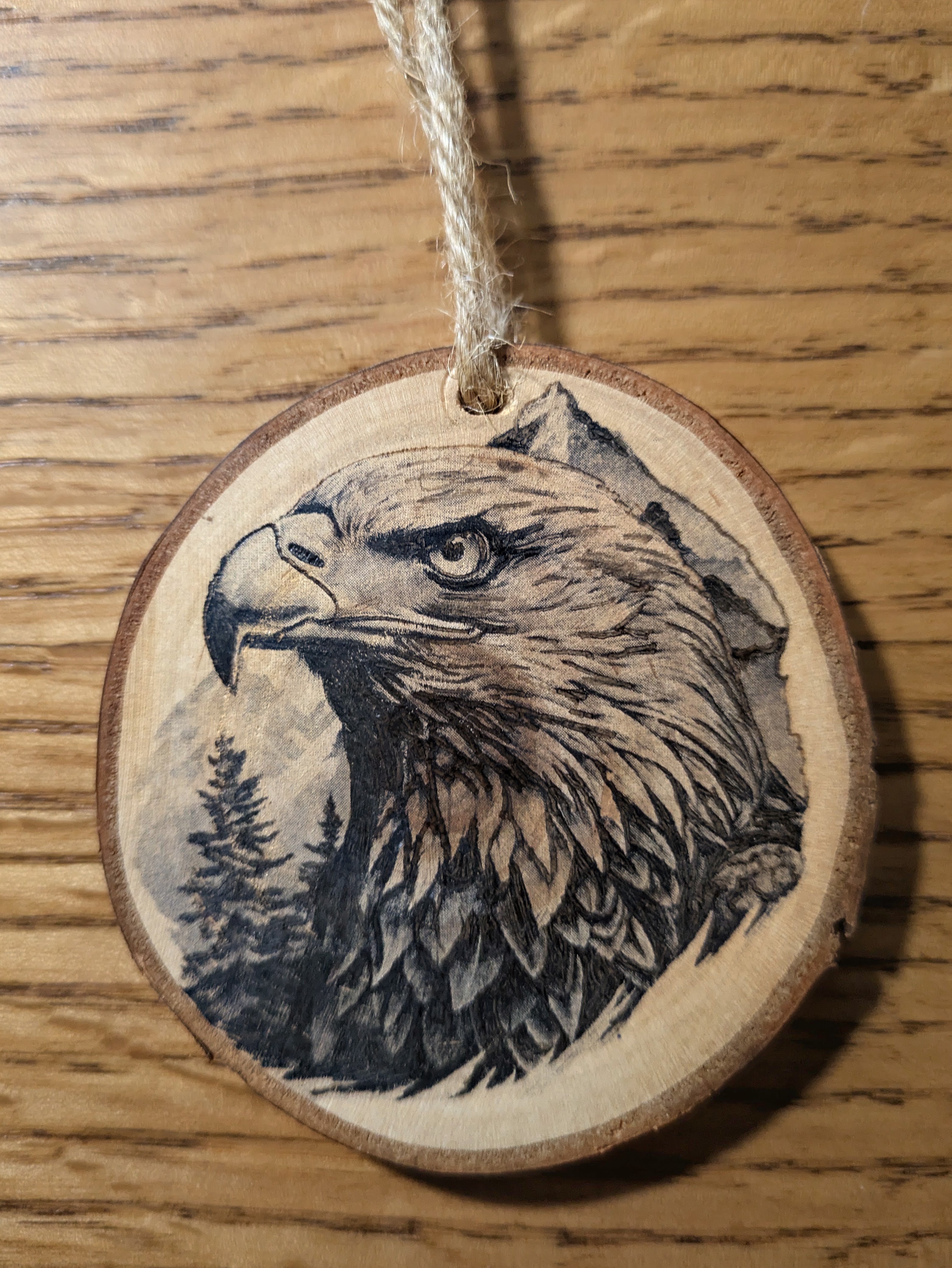 Wood slice ornament with a hand burned bald eagle
